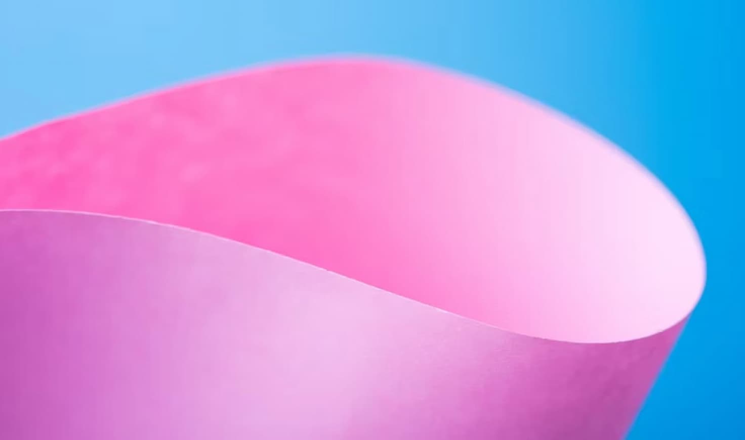 Pink shape in a light blue background